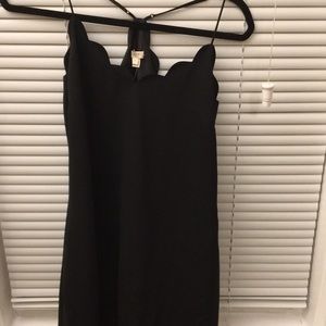 J Crew black slip dress with scalloped top.